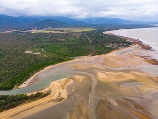 aerial drone panorama of rollingstone creek river mouth in beautiful rural town balgal beach; unique coastline of  tropical north queensland near townsville, australia