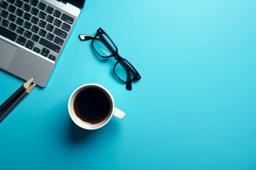 Workspace with laptop, pencils, coffee cup and glasses on blue background. Top view with copy space. Flat lay. Generative AI