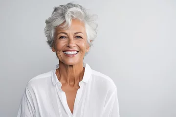Foto op Canvas Beautiful gorgeous 50s mid age beautiful elderly senior model woman with grey hair laughing and smiling. Mature old lady close up portrait. Healthy face skin care beauty, skincare cosmetics, dental. © radekcho