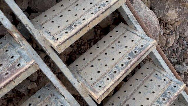 scaffold stair installed on a dirt slope in a mining quarry