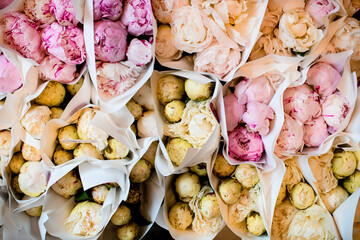 Colorful showcase of flower shop with large assortment of delicate fragrant fresh peonies © fesenko