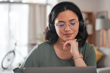 Woman, remote work and virtual assistant with headphones at laptop for video call, voip...