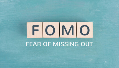 FOMO acronym for fear of missing out, social media and lifestyle concept, regret and depression,...