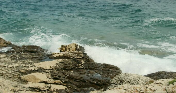 Jugo wind and waves on the rocky coast of the Adriatic Sea, Croatia
