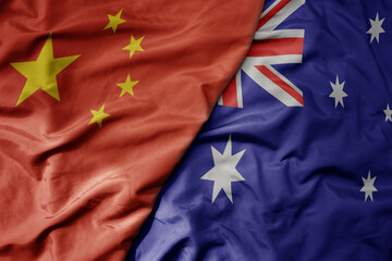 big waving national colorful flag of china and national flag of australia .