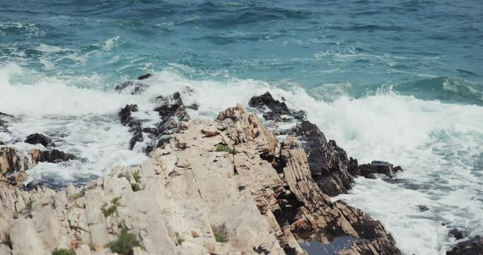 Jugo wind and waves on the rocky coast of the Adriatic Sea, Croatia