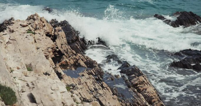 Jugo wind and waves on the rocky coast of the Adriatic Sea, Croatia