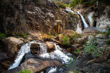 panorama of jourama falls in paluma range national park, north queensland, australia; cascade of...