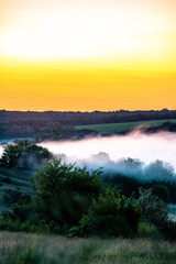 sunrise over the forest with fog 