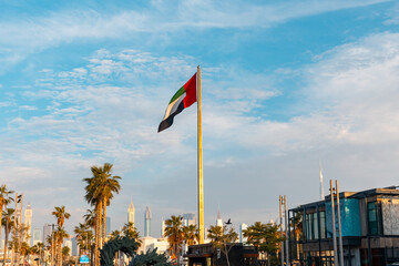 Dubai, United Arab Emirates - April 2023: La Mer Beach. National Flag of the emirates at the...
