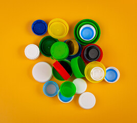 Plastic Bottle Caps Pile. Recycling HDPE Material Group, Circle Polyethylene Lid Set, Colorful Caps Group