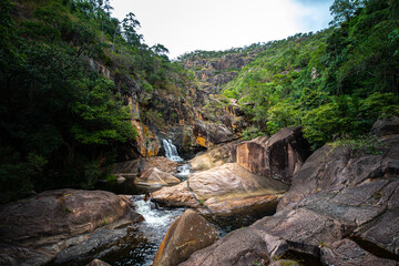 panorama of jourama falls in paluma range national park, north queensland, australia; cascade of numerous powerfull tropical waterfalls near townsville and ingham
