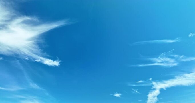 The sky was a brilliant blue, dotted with white clouds that moved gracefully across the sky..The wind gently blew them to and fro, seemingly without direction. .abstract sky nature background.
