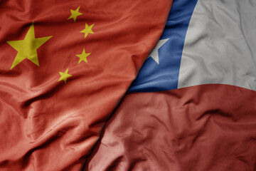 big waving national colorful flag of china and national flag of chile .