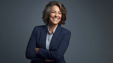 Portrait of happy woman looks in camera. Beautiful business woman professional in a suit at isolated background.  - obrazy, fototapety, plakaty