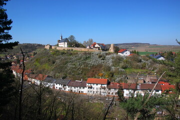 Fototapeta na wymiar Castle hill, church and residential houses in the old village of Neu-Bamberg, Rheinland-Pfalz region inGermany