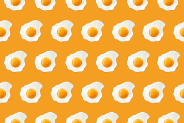 Fried eggs on a yellow background. Seamless pattern with scrambled eggs. Vector illustration of eggs. Realistic image.