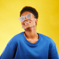 Happy, fashion and glasses with face of black woman in studio for vision, eye care and trendy...