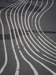 White striped line on black asphalt.