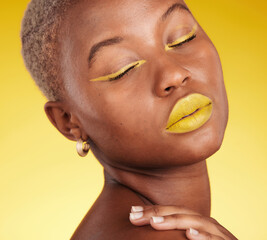 Cosmetic, art and woman in a studio with makeup eyeliner and lipstick for cosmetology. Beauty, creative and young African female model with a colorful glamour face routine by a yellow background. - obrazy, fototapety, plakaty