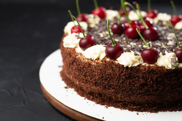Cherry cake and chocolate on the background