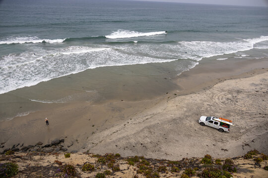The lifeguards watch the surfers at Solana Beach. 