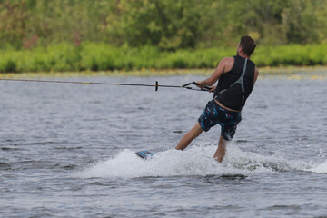 Young man waterskiing