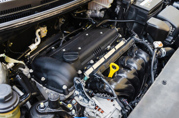 Fototapeta na wymiar Car engine close-up. Close up of car parts under hood after maintenance and washing
