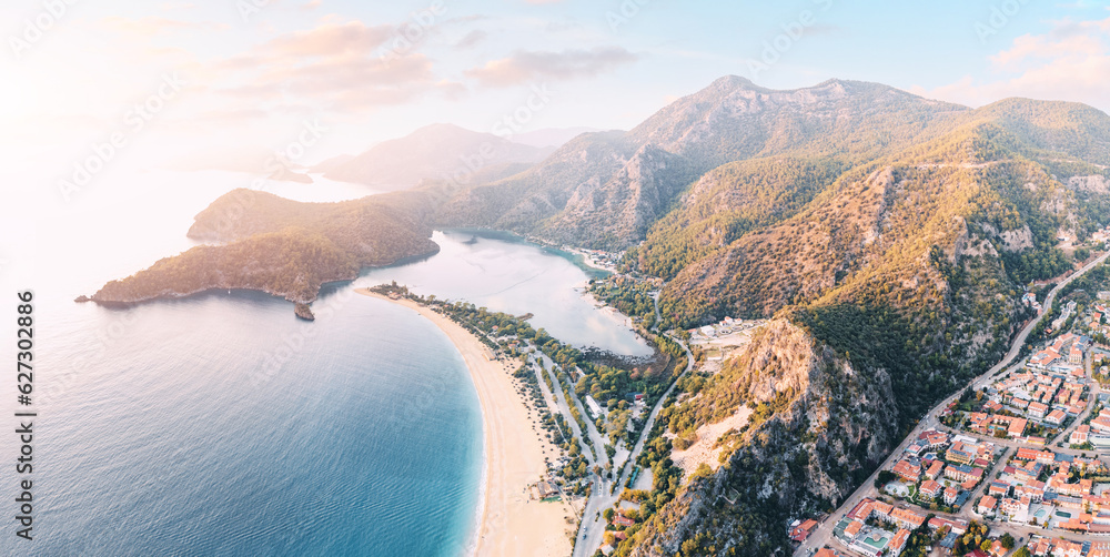 Wall mural Aerial view of a resort town Oludeniz in Turkiye at sunset. Travel landmarks and destinations - Wall murals