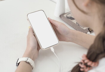 Mock-up Screen Smartphone, Smartphone in girl's hands,mobile phone with blank white screen