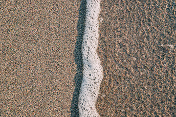 sand beach background texture, capturing the natural beauty and unique patterns found in the grains of sand.