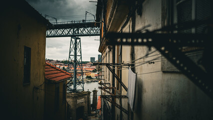 industrial view of the Luís I Bridge, grey weather, dramatic  colors, horizontal view