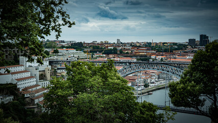 The landscape view of the Luís I Bridge, grey weather in Porto