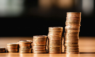 Coins stacks and growing bar chart - investment concept
