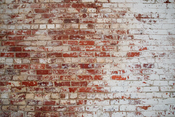 Old, but solid brick wall with whitewash and wear