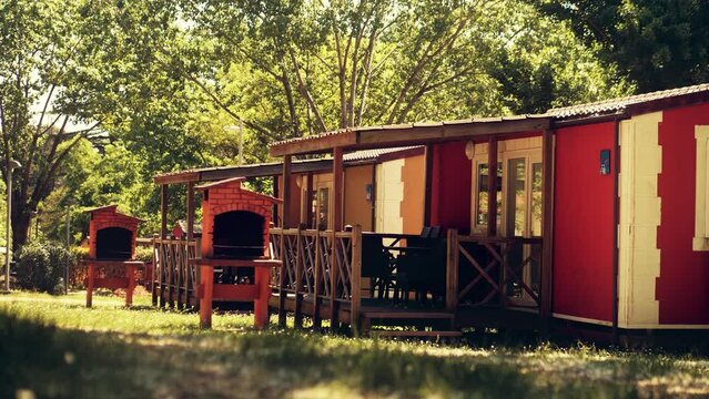 Generic camping mobile homes with barbeque places, summer vacation time
