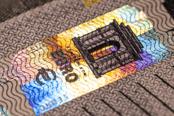 Five euro banknote. Euro money macro close-up. A separate token for European Union euro cash with a face value of five euros. Savings for the concept of financial freedom. Soft selective focus