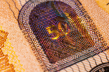 A fifty euro banknote. Euro money macro close-up. Separate news about the European Union euro cash, which has a nominal value of fifty euros. Savings for the concept of financial freedom.