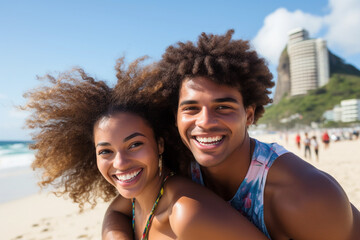 Portrait of a young Brazilian black couple in a piggyback position, having fun at the beach.