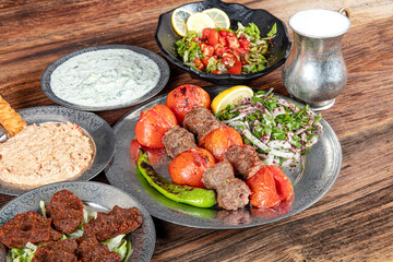 Turkish cuisine tomato kebab. Tomato kebab, domates kebab with grilled vegetables.