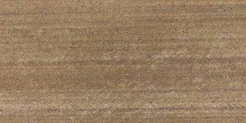 panorama of surface from above of gravel road with car tire tracks. © hiv360