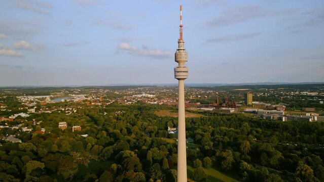 Aerial footage cityscape Florianturm or Florian Tower telecommunications tower and Westfalenpark in Dortmund, Germany