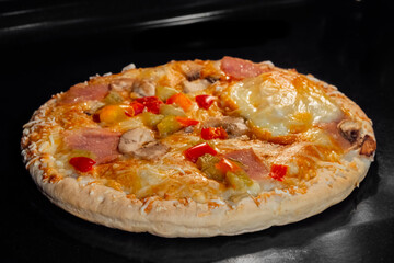 Pizza with sausage, mushroom, pepper, mozzarella baking on tray in electric oven. Italian cuisine, homemade bakery, fast food, cooking concept