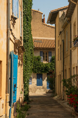 Fototapeta na wymiar Street of old town of Arles, south France, mediterranean architecture