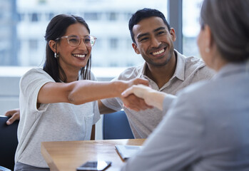 Couple, happy and handshake with financial consultant for deal, agreement or contract. Smile, man...