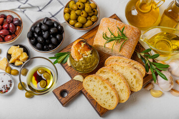 Bruschetta with olive oil, olives, pesto, garlic and parmesan. ciabatta bread with olive oil and spices. Delicacy. Delicious and healthy food. Vegan. Place to copy. copy space.