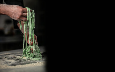 Raw italian pasta fettuccine or tagliatelle. cooking process, banner, menu, recipe place for text
