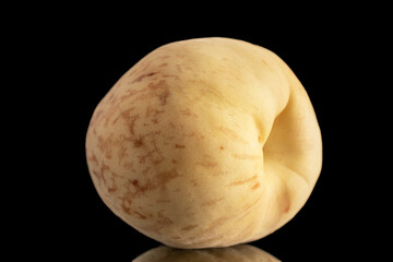 One juicy ripe peach, macro, isolated on black background.