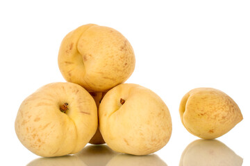Several juicy ripe peaches, macro, isolated on white background.