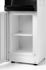 Open empty mini fridge isolated on white background